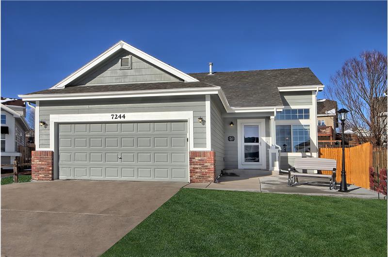 Located in a quiet cul-de-sac!  Front yard with large front porch with lamp post, split rail fence, and five aspen trees