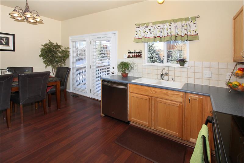 Kitchen sink has a window that looks into the backyard