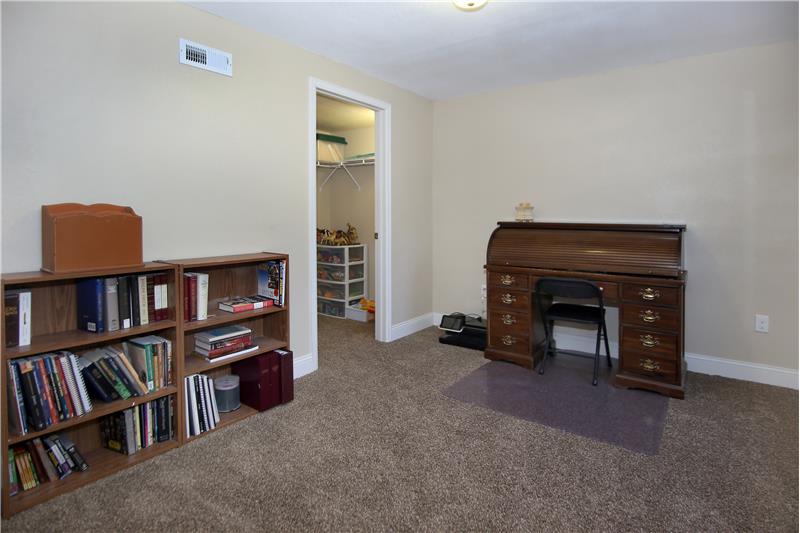 Basement bedroom or office with walk in closet 