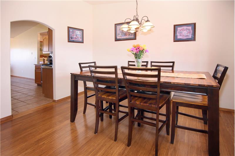 Formal dining room with hardwood flooring