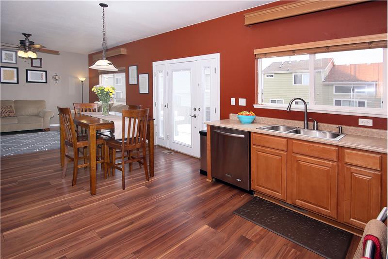 Kitchen opens up into family room and walks out to a large patio in the backyard