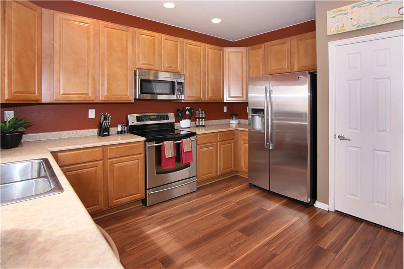 Recessed lighting, kitchen pantry, all stainless steel appliances stay!