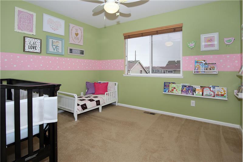 Bedroom on upper level with walk-in closet