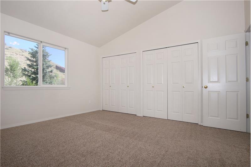 Large master bedroom with double closets and vaulted ceilings!