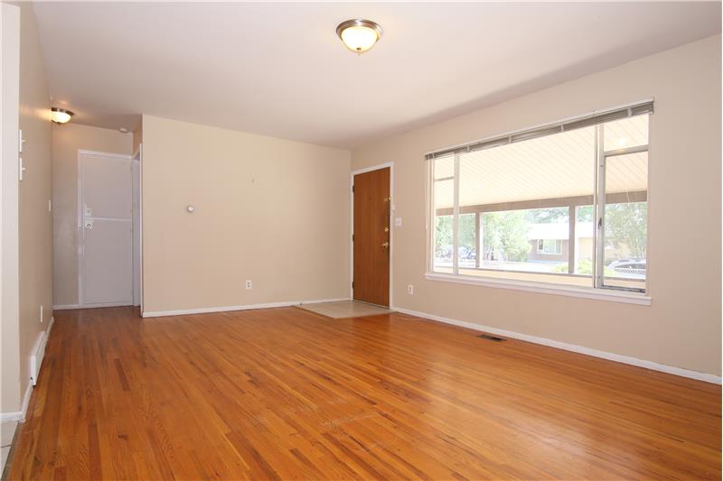 Bright living room with hardwood flooring!