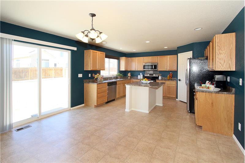 View of eat-in kitchen and walk-out to backyard