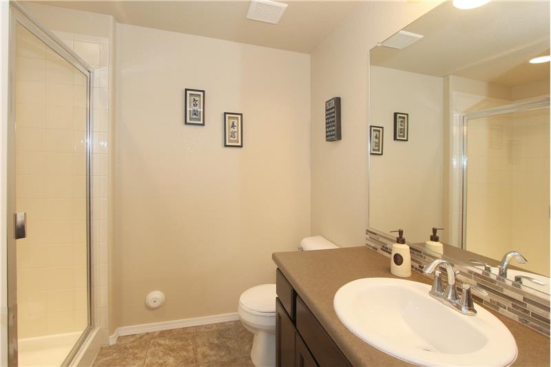 3/4 bath in basement with a large shower