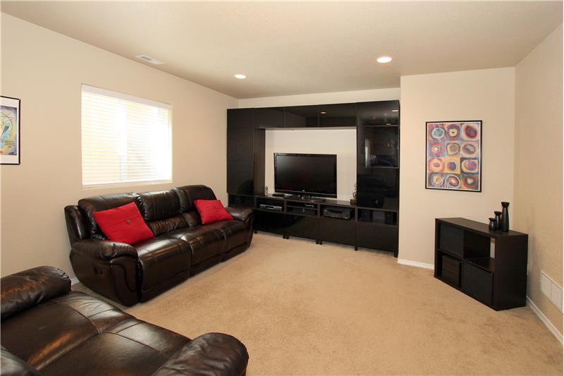 Large Rec Room in the basement with recessed lighting on 9ft ceilings!