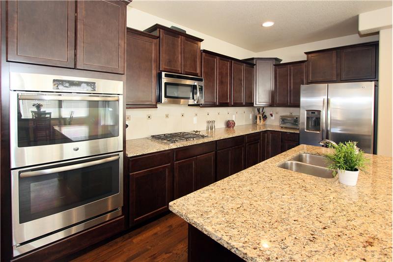 Gourmet kitchen features double ovens and a gas cooktop!