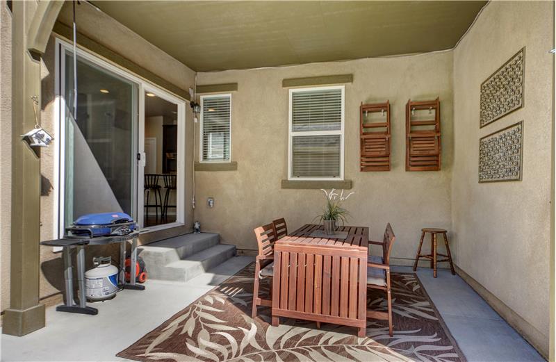 Enclosed/covered patio in backyard is great for entertaining!