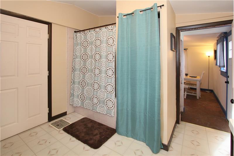 View of linen closet and tub/shower
