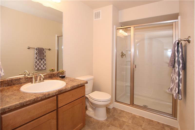 3/4 bath in basement with a large shower