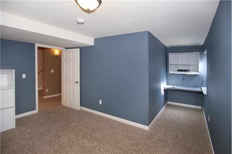 edroom 4 with large walk-in closet and built-in desk!