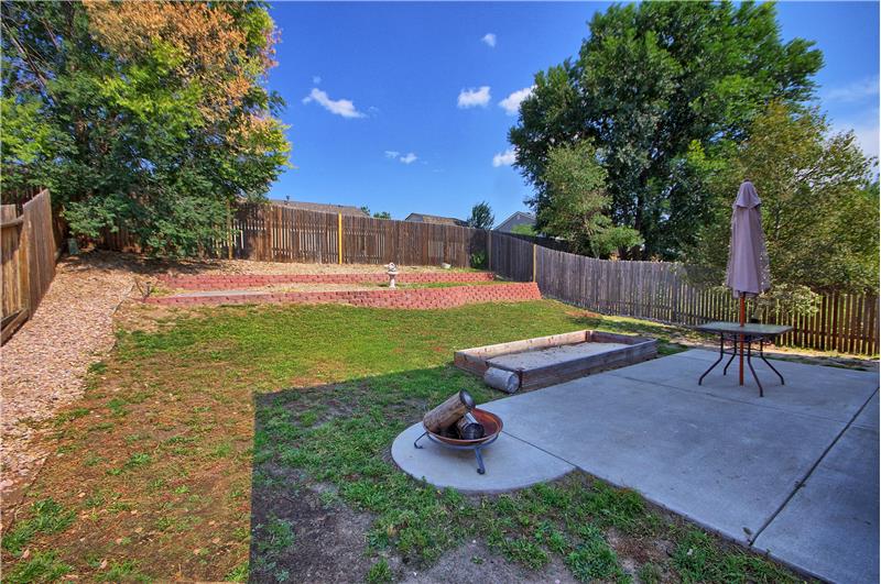 Fenced backyard with 12 x 18 patio