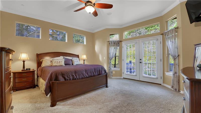 Spacious master bedroom with French doors to access the back deck