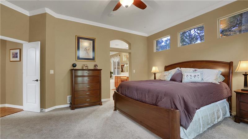 Master Bedroom with in-ceiling speakers, crown molding, and an adjoining 5-piece bathroom