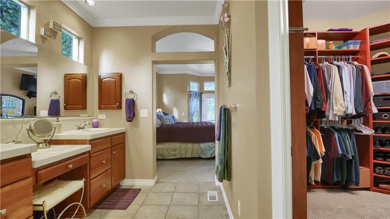 Master bath with customized walk-in closet, and linen closet