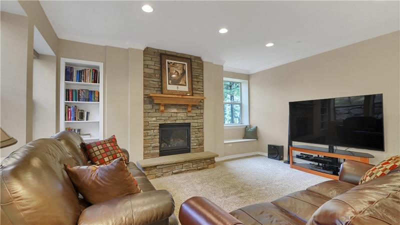 Lower level family room with built-in shelving