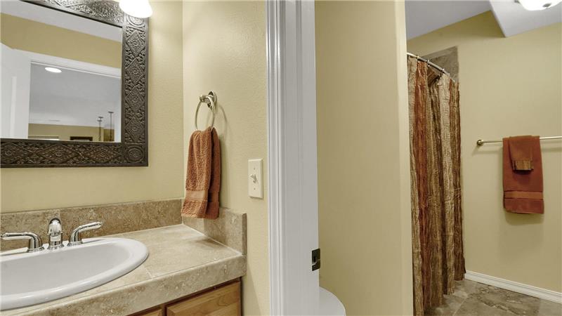 3/4 bath with tile, comfort height vanity, and linen closet