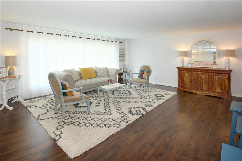 Spacious living room with beautiful flooring!