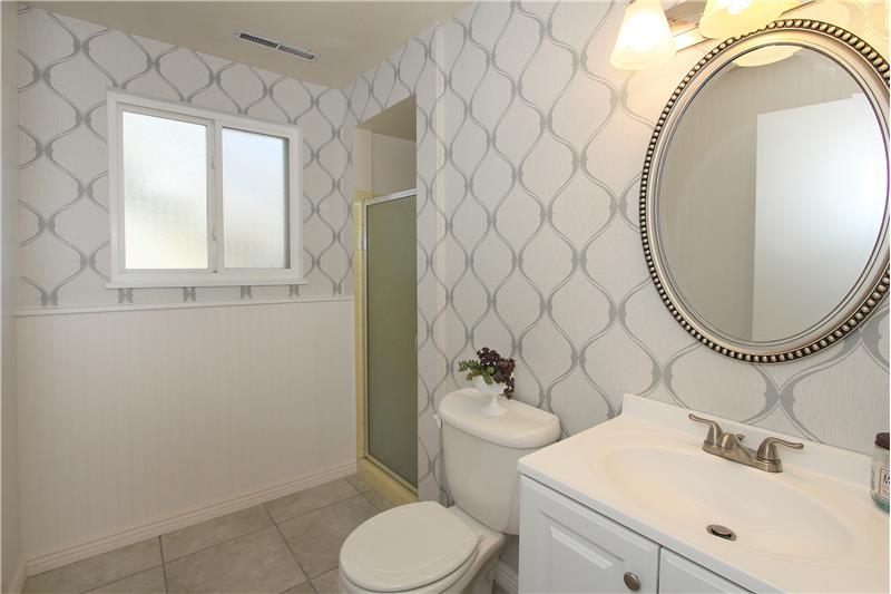 Updated 3/4 bath with tile and wainscoting!