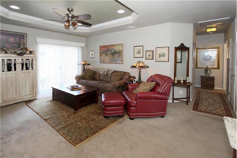 Living room provides walk-out to the backyard.