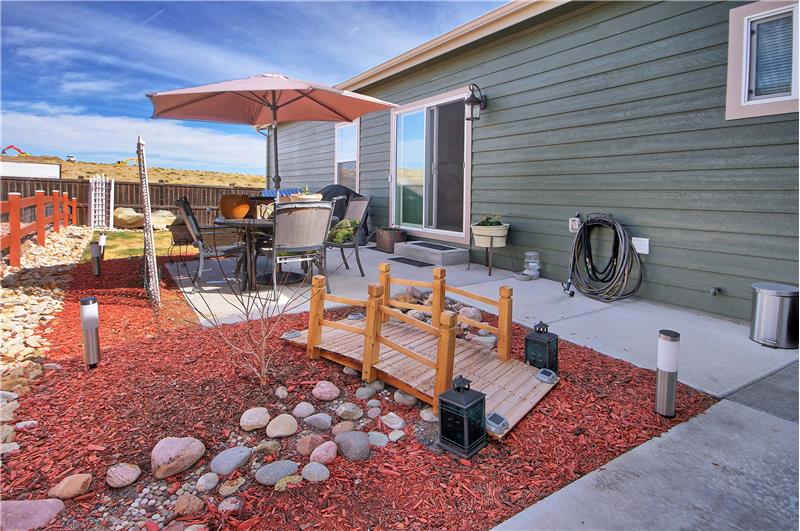 Fully fenced and landscaped backyard with enlarged 10 x 11 patio and extension patio for the gas grill. Walkways from patio to d