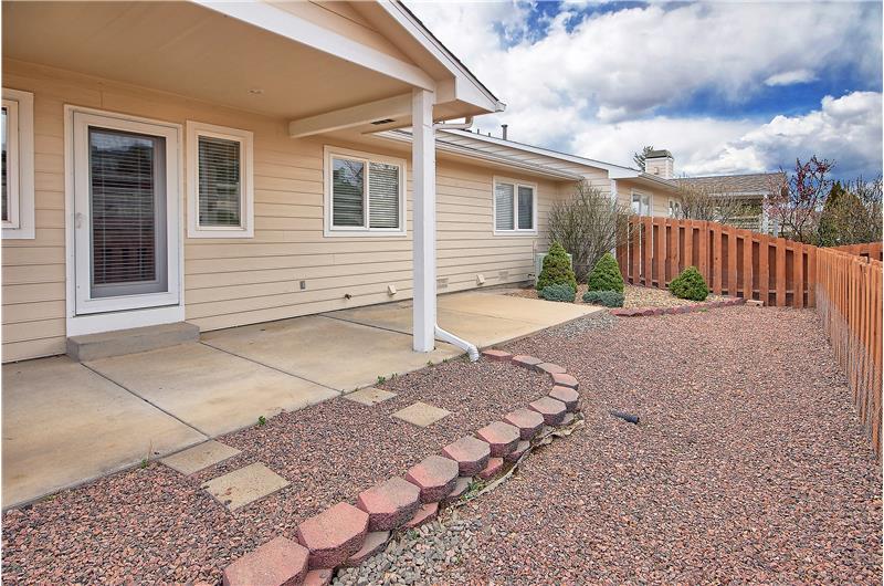 Low-maintenance backyard with covered patio!