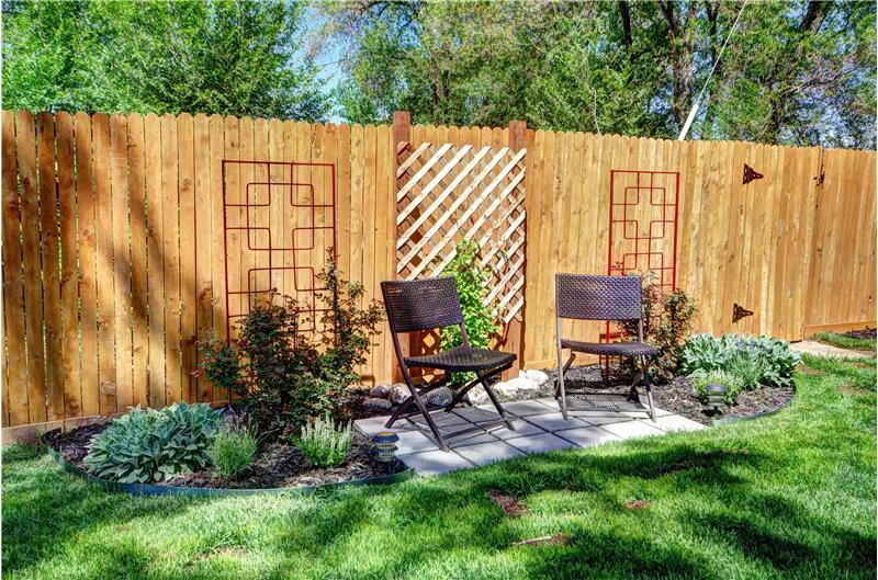 Landscaped backyard with perennials and newer fencing!