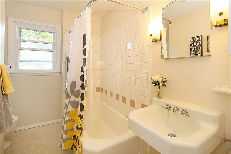 Full bath with built-in cabinet
