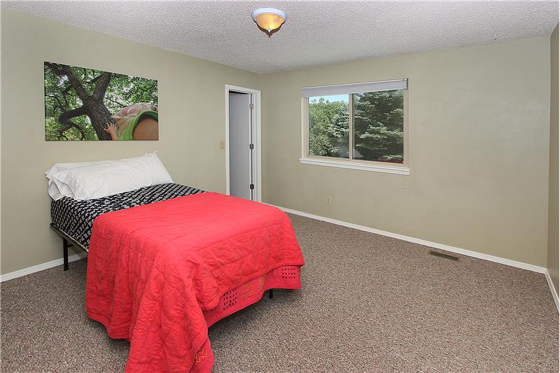 Bedroom 2 with new carpet and walk-in closet