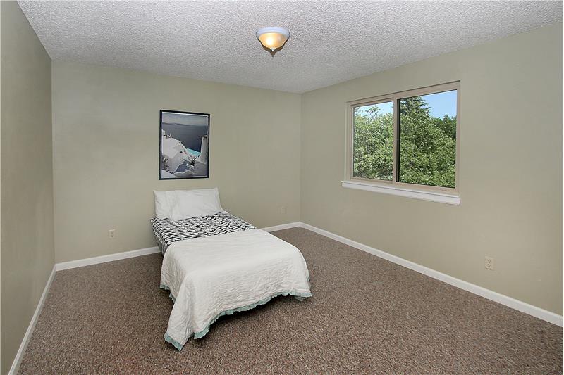 Bedroom 3 with new carpet and walk-in closet