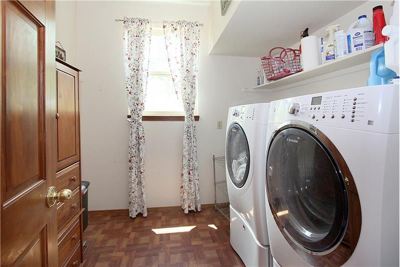 Main level laundry room with window