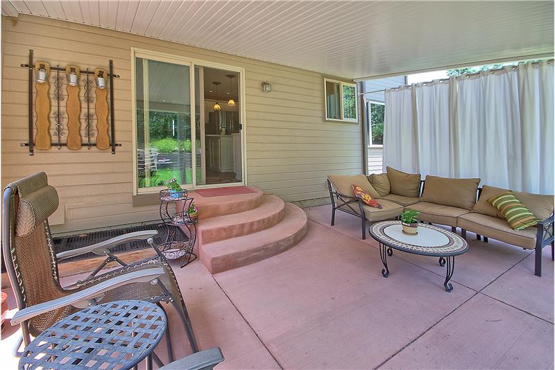Covered back patio is great for entertaining