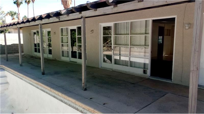 Great Glass walls in back looking at pool