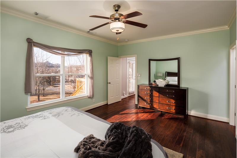Master Bedroom Suite, oversized windows, view of open commons area and hills