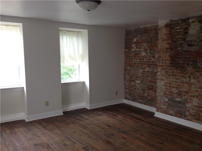 Master with nice exposed brick. Must see large walk in closet and master bath!