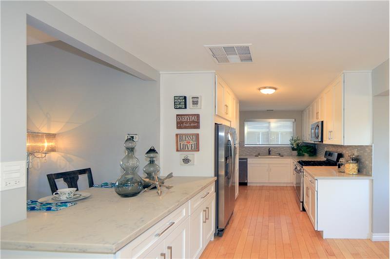 Remodeled Kitchen w/White Cabinets & Quartz Counters