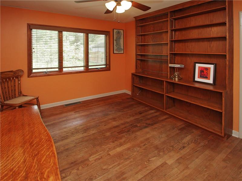 Third bedroom with built in book shelves