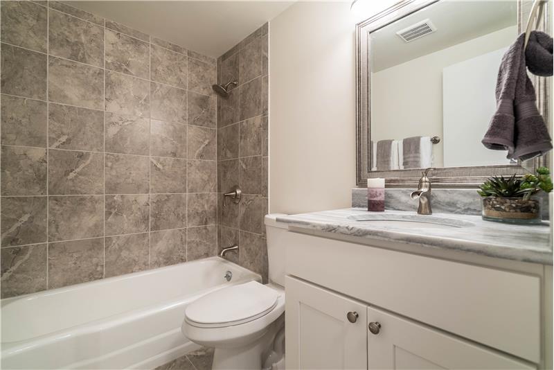 Full bath with tub/shower combo; new commode
