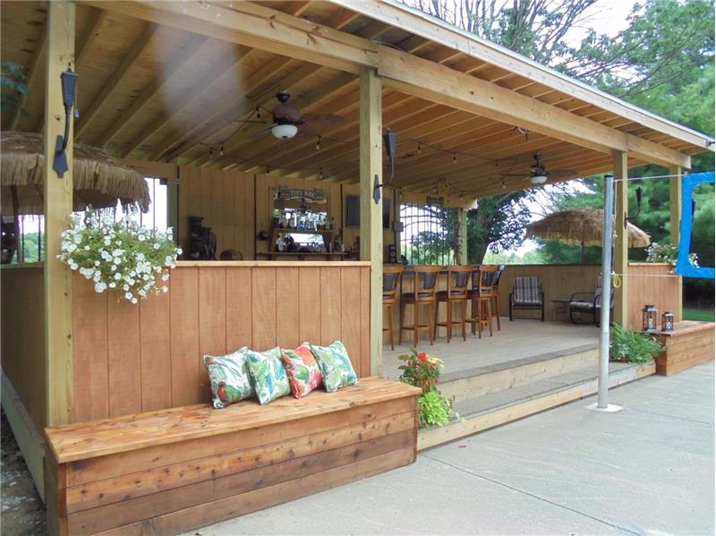 Something for everyone including outdoor bar, multi sport court, gazebo, and screened porch.