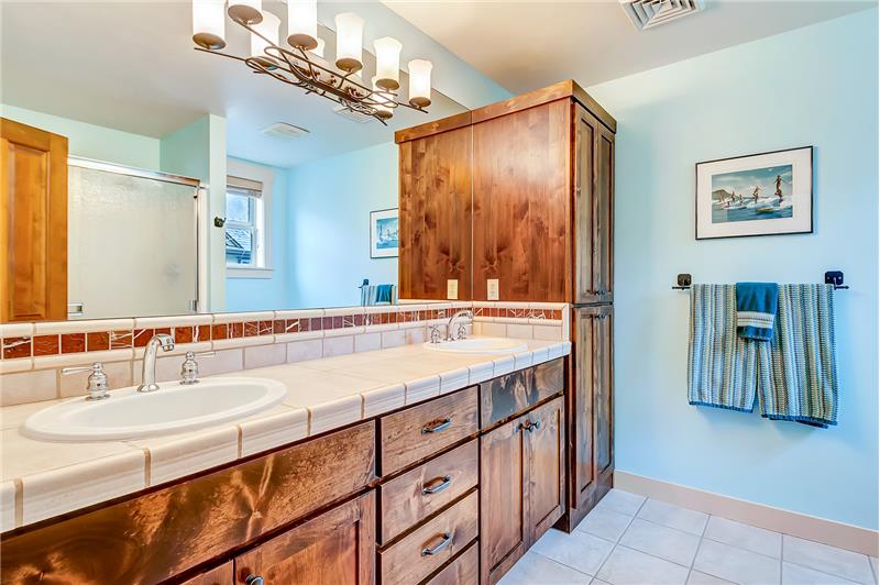 Dual vanities and ample storage in master bath.