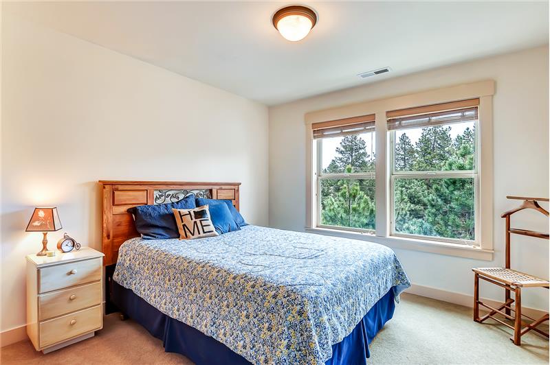 Well appointed guest room with plenty of natural light.