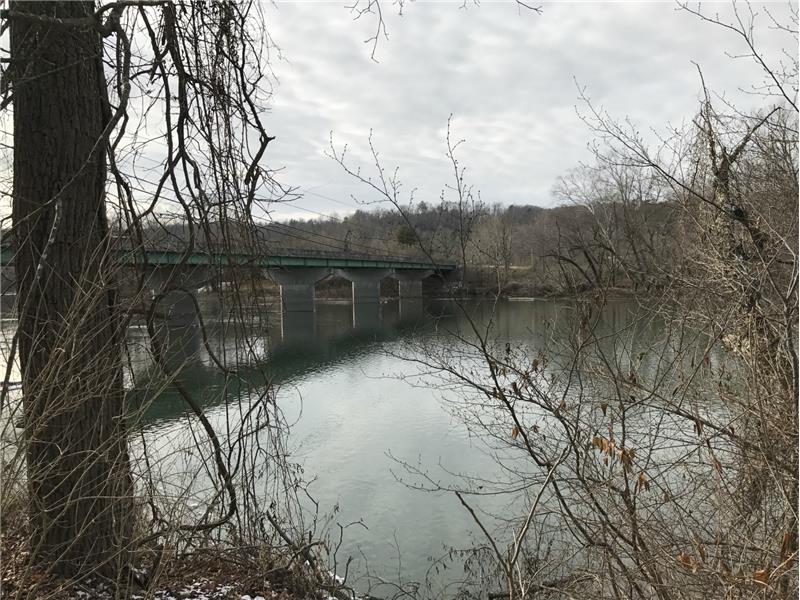 view of bridge across river, winter scene