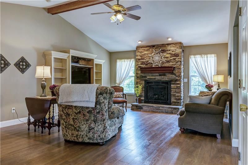 Great room with handsome hand picked stone fireplace