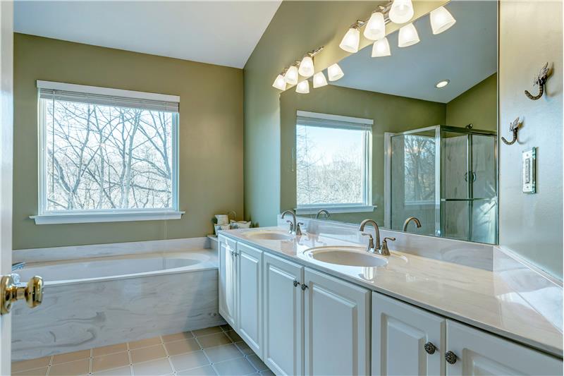 Luxury Master Bath with double sinks, separate tub & shower.