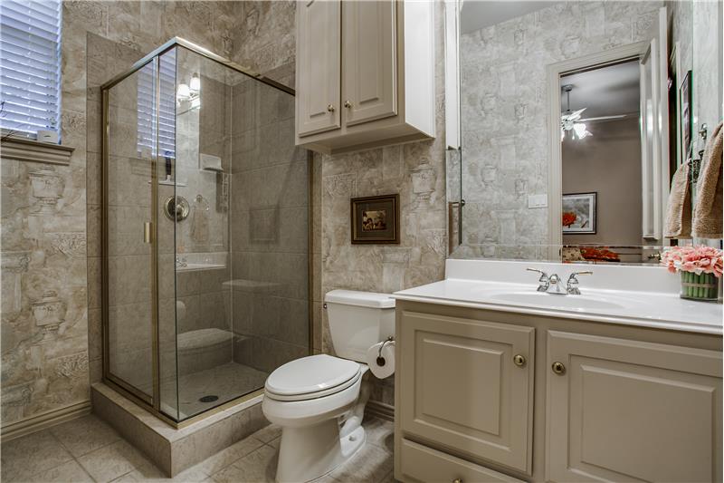 Main level guest room bathroom features stand alone updated shower