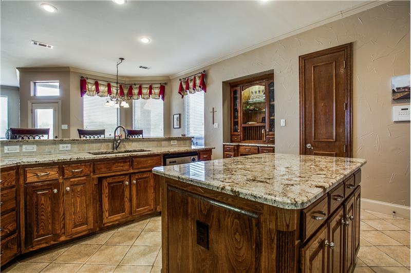 Kitchen is a place for family and friends to be together and this space has  plenty of space for it