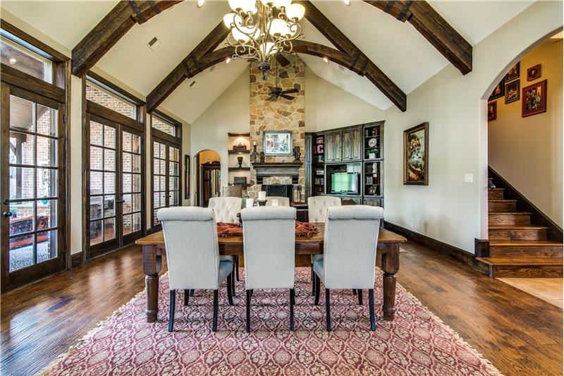 Living room features 24ft cathedral ceiling accented with rustic custom beams