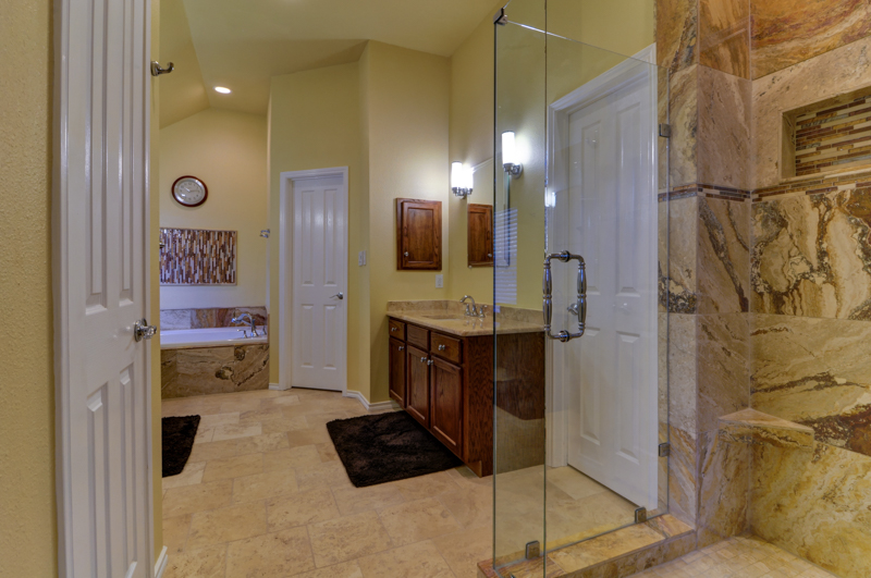 Updated Master Bath with Walk In Shower and Travertine Tile